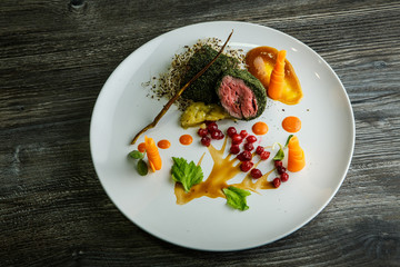 top view medium raw meat in green dill served with wheat sprouts