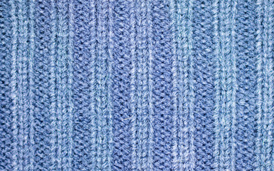 Background of the wool yarn. Woolen fabric texture closeup. Textile texture background. Detailed warm yarn background.