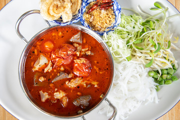 rice noodles with spicy pork sauce or Khanom Jin Nam Ngiao, northen Thai food.