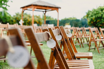 Retro empty vintage style wooden chairs for events and weddings