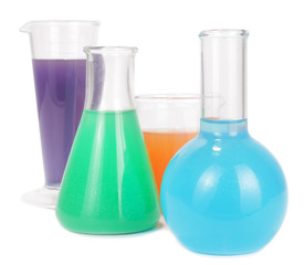 Chemicals liquids colorful in glass chemistry bottles