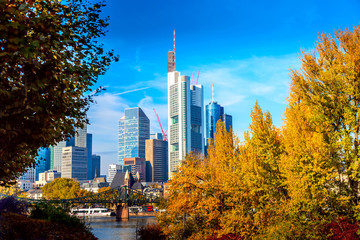 Skyline cityscape of Frankfurt, Germany with bridge and skyscrapers during sunny day in autumn. Frankfurt Main in a financial capital of Europe. - obrazy, fototapety, plakaty