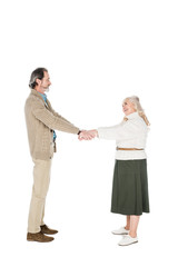 cheerful couple shaking hands isolated on white