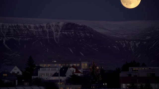 Flock of geese flying under full moon, Esja mountain Reykjavik Iceland.mov