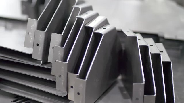 Metal parts after cutting and bending process