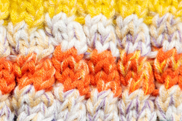 Background of the wool yarn. Woolen fabric texture closeup. Textile texture background. Detailed warm yarn background.