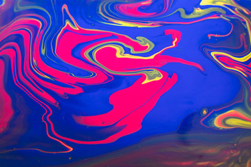 Abstract painting background in vivid colors. Marbleized bright effect with fluid painting, background for wallpapers, poster, postcard. Swirls and lines with yellow, blue, magenta white. Pop colors