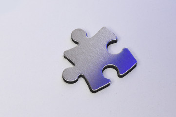 Obraz premium metal puzzle on a white background