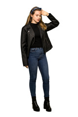 A full-length shot of a Teenager girl with leather jacket with tired and sick expression on isolated white background