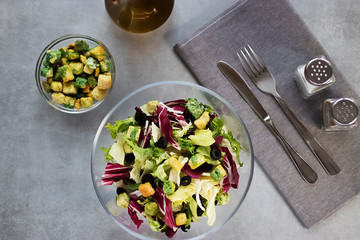 Salad of mix leaves with croutons and olive oil. Concept vngetarianism.