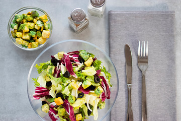 Salad of mix leaves with croutons and olive oil. Concept vngetarianism.