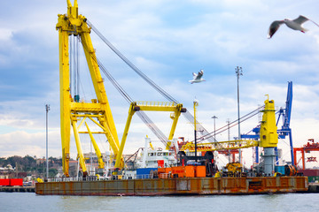 Fototapeta na wymiar Logistics and transportation of Container Cargo ship and Cargo plane with working crane bridge in shipyard, logistic import export and transport industry background