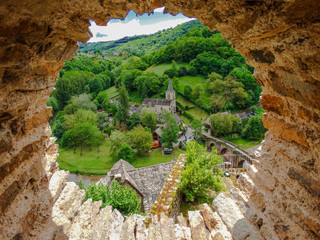 Belcastel medieval church, with medieval bridge over the Aveyron river, Aveyron, France