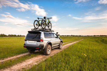 SUV with two bicycles on roof rack