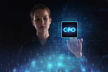 The concept of business, technology, the Internet and the network. A young entrepreneur working on a virtual screen of the future and sees the inscription: CFO