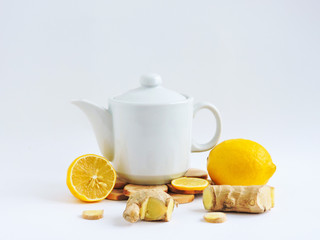 Lemons and ginger on a white background.Healthy food. Ginger Root Tea with Lemon. Healthy...