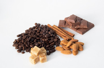 coffee,chocolate,beans,background,spices,anise,cinnamon,sweet,food,brown,nut,dessert,gourmet,almonds,spice,sugar,wooden,tasty,broken,white,cocoa,closeup,delicious,black,orange,isolated,close,snack,mil
