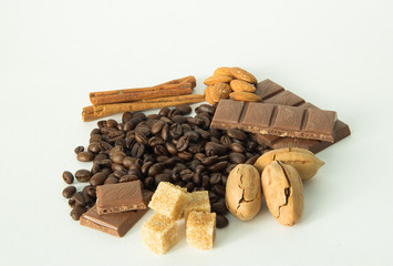 coffee,chocolate,beans,background,spices,anise,cinnamon,sweet,food,brown,nut,dessert,gourmet,almonds,spice,sugar,wooden,tasty,broken,white,cocoa,closeup,delicious,black,orange,isolated,close,snack,mil