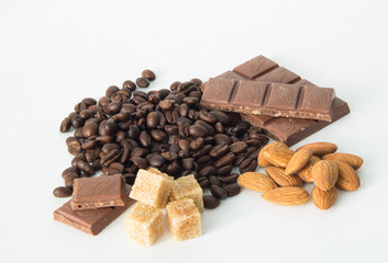 coffee,chocolate,beans,background,spices,anise,cinnamon,sweet,food,brown,nut,dessert,gourmet,almonds,spice,sugar,wooden,tasty,broken,white,cocoa,closeup,delicious,black,orange,isolated,close,snack,mil