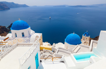 Sunny morning view of Santorini island. Famous Greek resort Oia, Greece, Europe. Traveling concept...