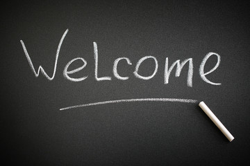 Fototapeta premium Welcome word on a blackboard. Greeting concept