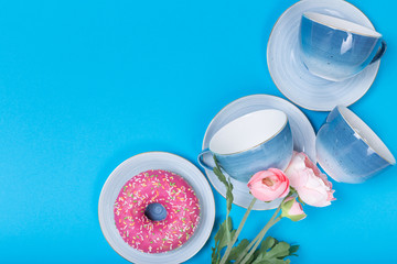 cups on a blue background top view