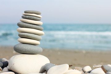 pyramid of pebbles on the beach, close-up and free space for text, Cyprus
