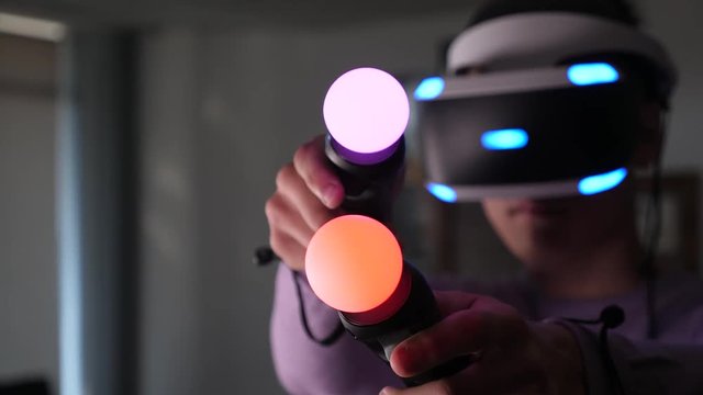 Boy is using virtual reality headset at office 4k