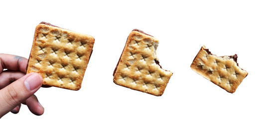 isolated hand with cracker on white background with clipping path