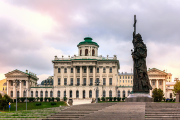 Fototapeta premium The monument to Saint Prince Vladimir the Baptist on Borovitskaya square in Moscow, Russia. Pashkov House in the background. 