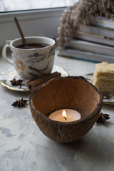 A cup of coffee and cake on a desk. Morning breakfast.