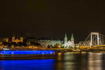 View of City Mother Church of the Blessed Virgin and Elisabeth Bridge in Budapest at night. Hungary