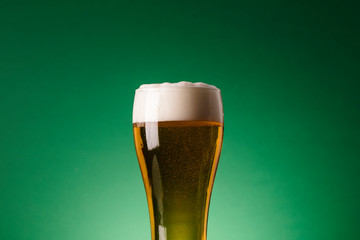 St Patrick's Day beer against a green background