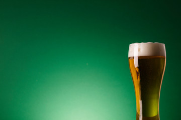 St Patrick's Day beer against a green background