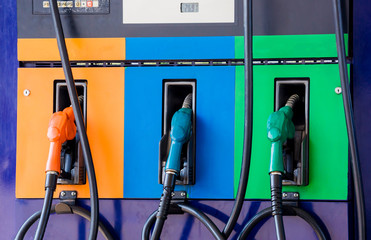 Close up fuel nozzles at gas station