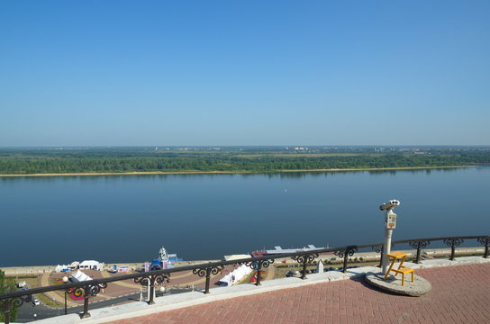 Summer view of the Nizhnevolzhskaya embankment and the Volga river from the observation deck of Chkalov stairs in Nizhny Novgorod, Russia