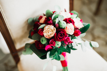 Beautiful wedding bouquet with different flowers, roses