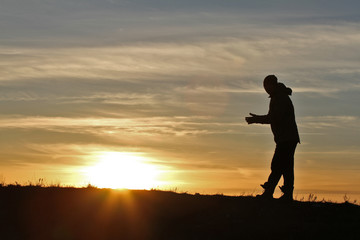 Fototapeta premium Man on sunset background