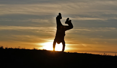 Man on sunset background