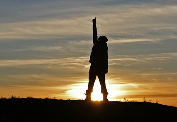 Fototapeta premium Man on sunset background