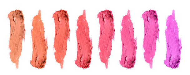 Set of different bright lipstick smears isolated on white, top view