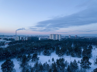 Aerial view of city Tallinn with winter forest