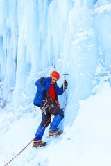 climber preparing to climb an ice wall