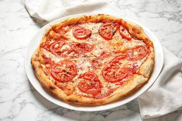 Hot cheese pizza Margherita on marble table