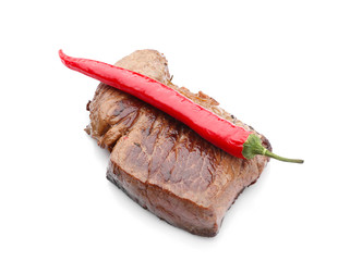 Tasty cooked meat with chili pepper on white background