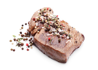 Tasty cooked meat with spices on white background