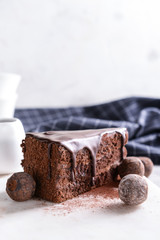 Piece of tasty chocolate cake on table