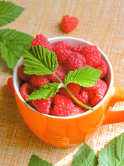 Fresh Raspberries background. Strawberry. Food background.Copy space. Top view, healthy food for breakfast. Eco, organic summer diet food. Ripe Raspberries from garden in a mug .Summer Raspberries . 