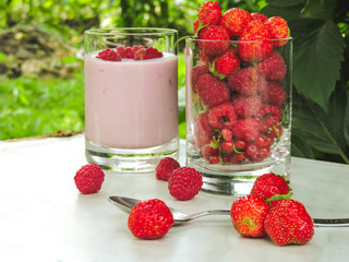 Set of various fresh summer berries. Close up, selective focus.Summer healthy fruit. Food pattern.Summer Food Concept. Homemade yogurt with fresh strawberry and  raspberries.Top view.berry fruit.
