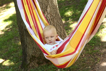 child hammock outside picnic weekend nature calm